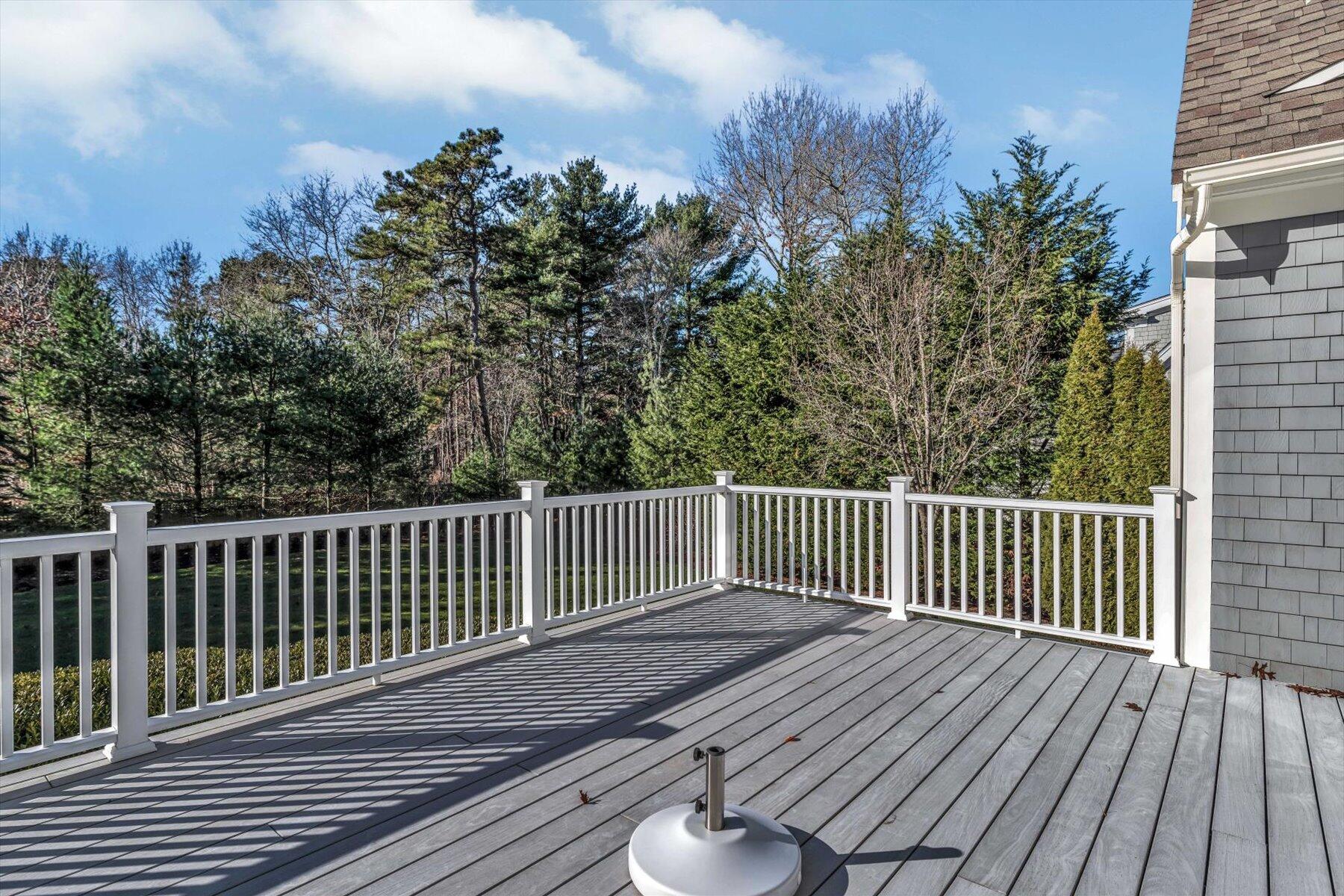 66 Eagle Drive Mashpee, MA 02649 - Photo 28 of 36 a balcony with wooden floor and fence