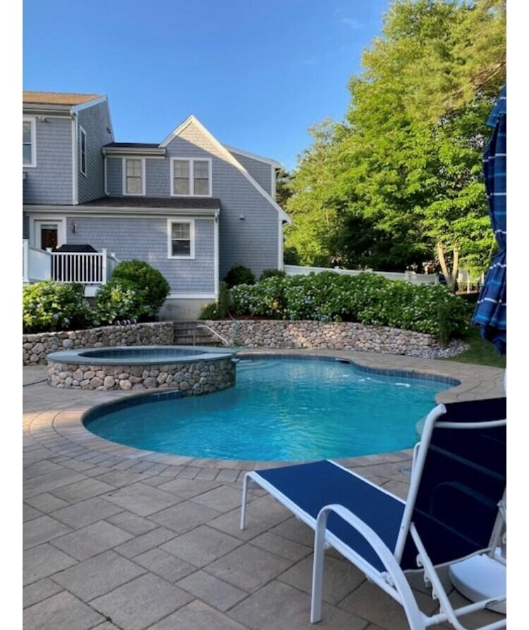 66 Eagle Drive Mashpee, MA 02649 - Photo 3 of 36 a front view of house with outdoor seating and yard