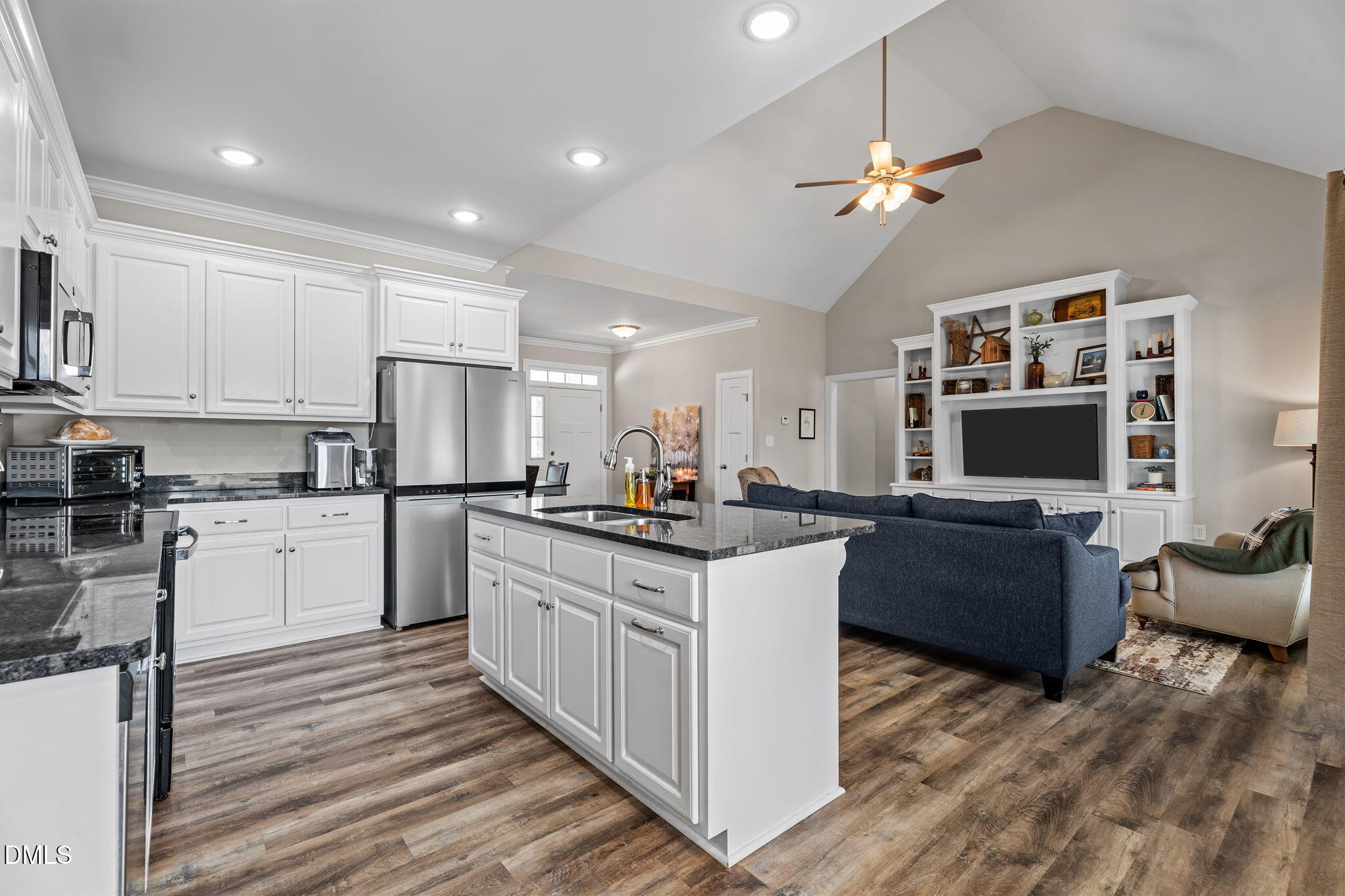 8772 Surrey Top Road Bailey, NC 27807 - Photo 11 of 42 a kitchen with kitchen island granite countertop a sink and refrigerator