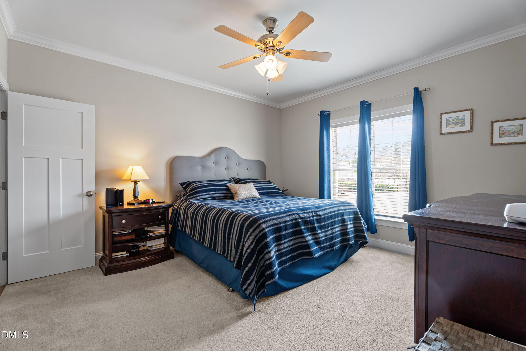 8772 Surrey Top Road Bailey, NC 27807 - Photo 17 of 42 a bedroom with a bed and a ceiling fan