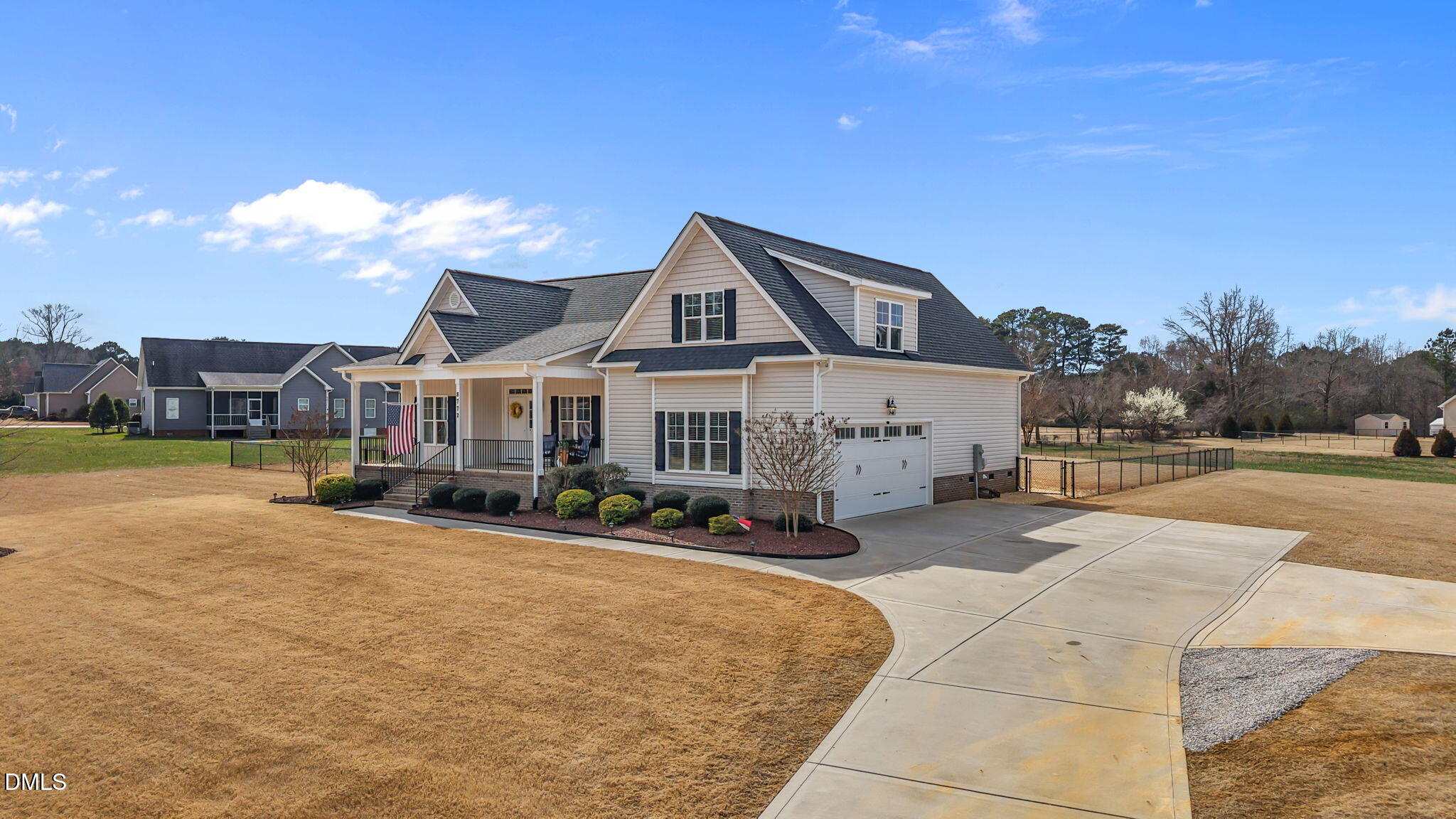 8772 Surrey Top Road Bailey, NC 27807 - Photo 34 of 42 a front view of a house with yard and a garden