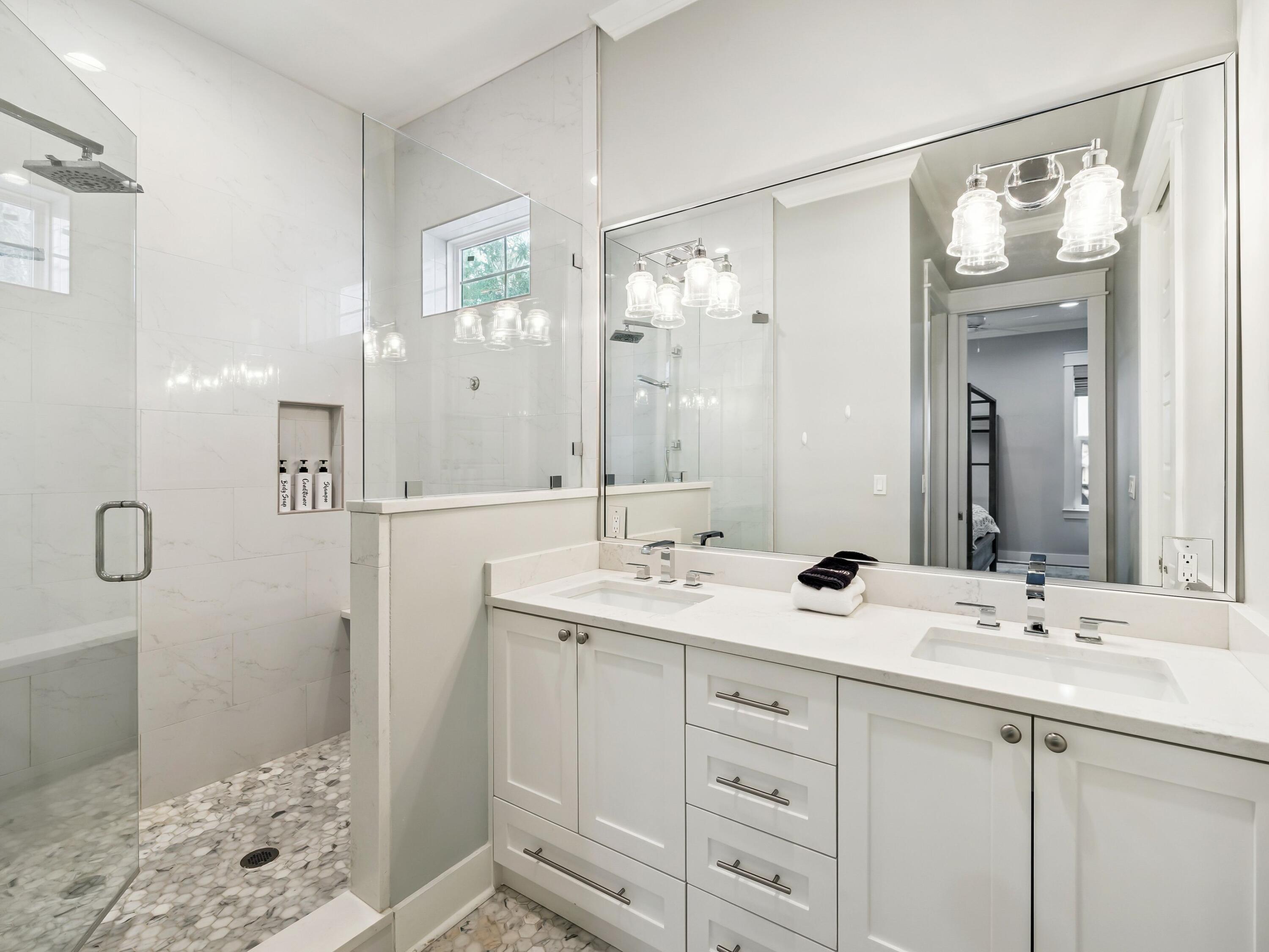 29 Tidewater Ct Inlet Beach Inlet Beach, FL 32461 - Photo 12 of 25 a bathroom with a double vanity sink mirror and shower
