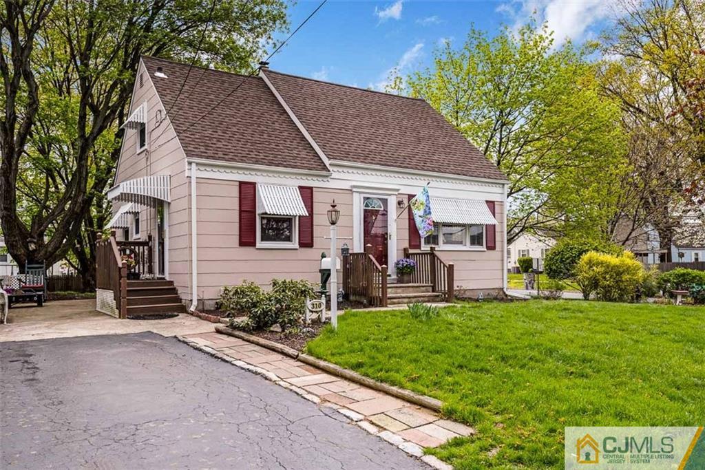 310 Howard Avenue Middlesex, NJ 08846 - Photo 1 of 25 front view of a house with a yard