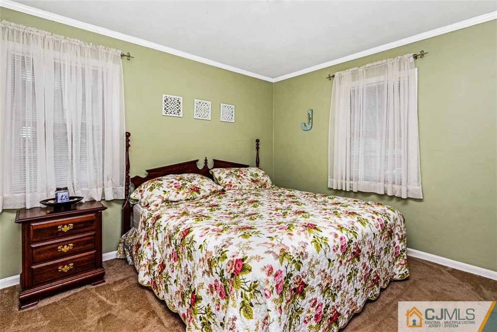 310 Howard Avenue Middlesex, NJ 08846 - Photo 11 of 25 a bedroom with a bed and a dresser