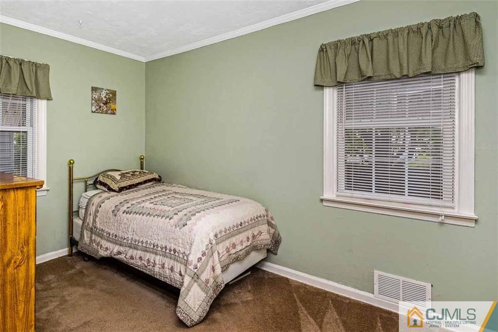 310 Howard Avenue Middlesex, NJ 08846 - Photo 12 of 25 a bedroom with a bed and a window