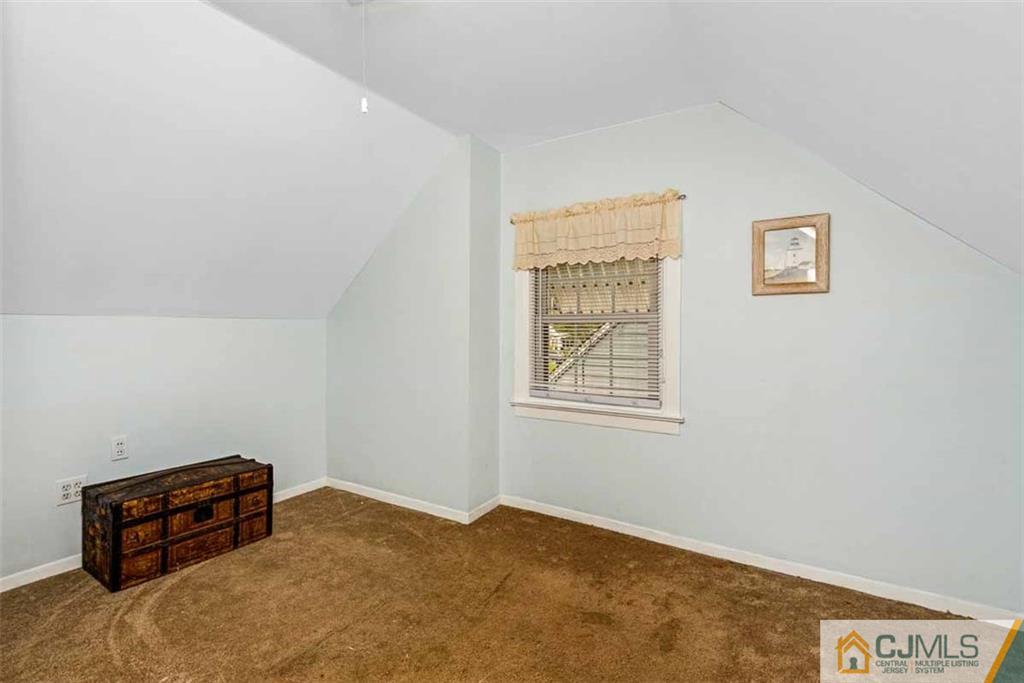 310 Howard Avenue Middlesex, NJ 08846 - Photo 14 of 25 a room with a bed and a window
