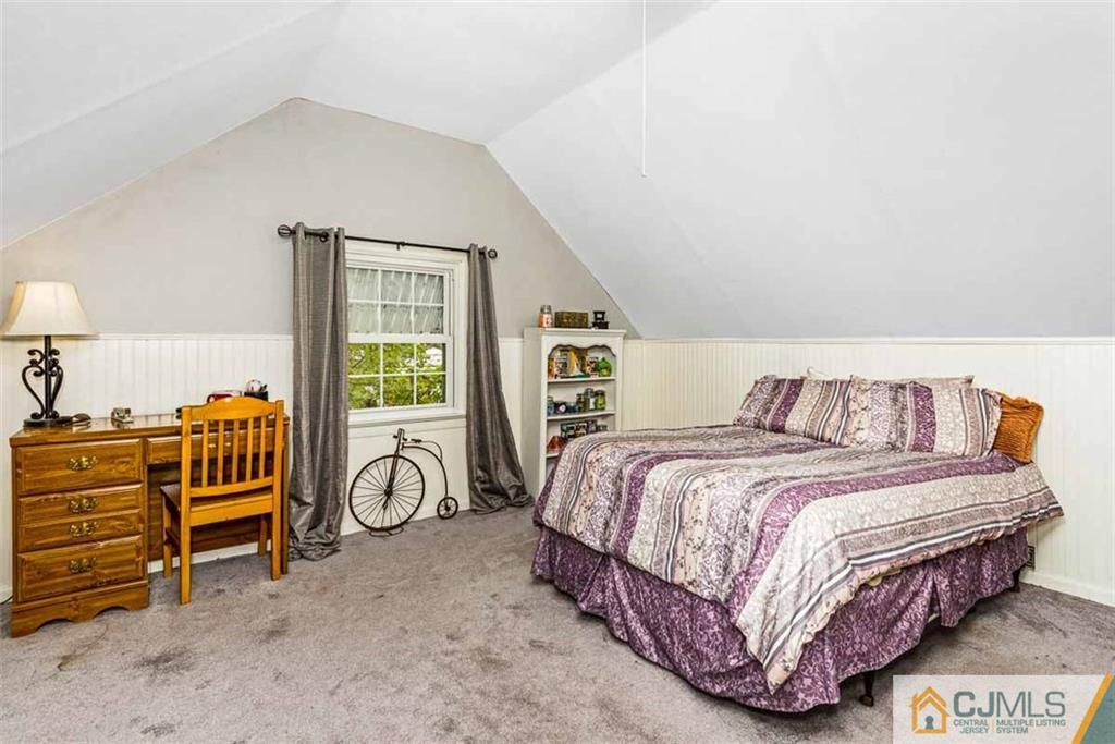310 Howard Avenue Middlesex, NJ 08846 - Photo 15 of 25 a bedroom with a bed and a table