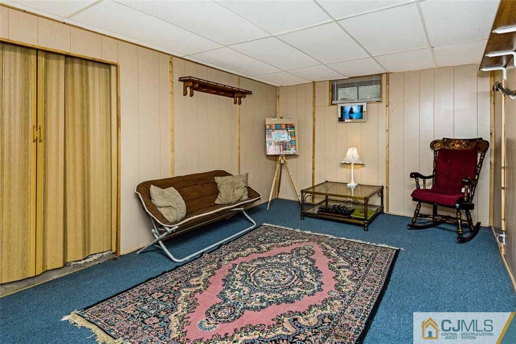 310 Howard Avenue Middlesex, NJ 08846 - Photo 16 of 25 a living room with furniture and a rug