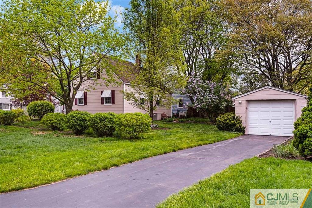 310 Howard Avenue Middlesex, NJ 08846 - Photo 21 of 25 a front view of a house with a yard
