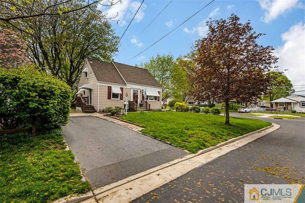 310 Howard Avenue Middlesex, NJ 08846 - Photo 22 of 25 a front view of a house with a yard