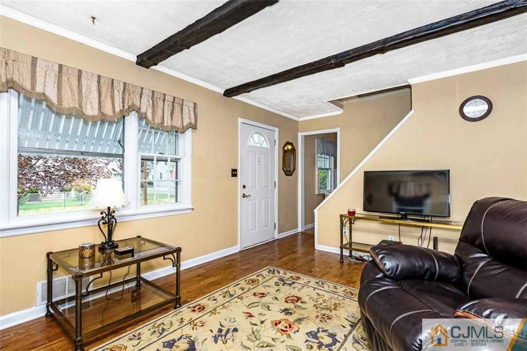 310 Howard Avenue Middlesex, NJ 08846 - Photo 9 of 25 a living room with furniture and a flat screen tv