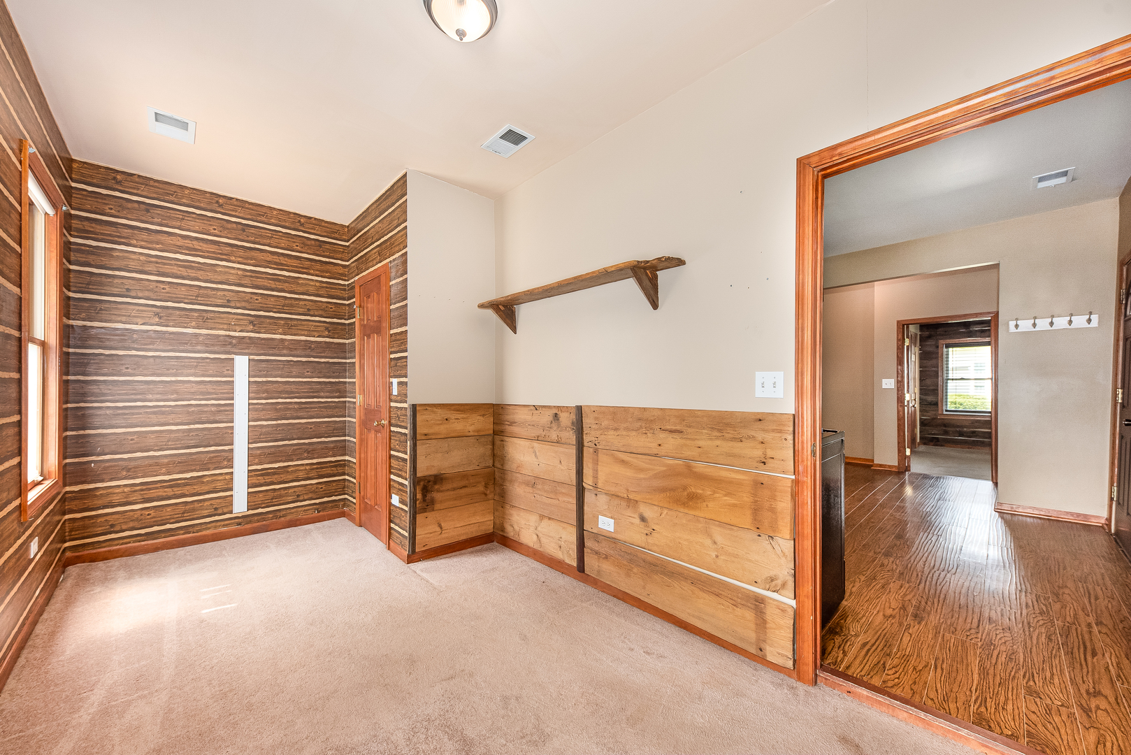 106 Round House Street Braidwood, IL 60408 - Photo 16 of 27 a view of an empty room with furniture and a window