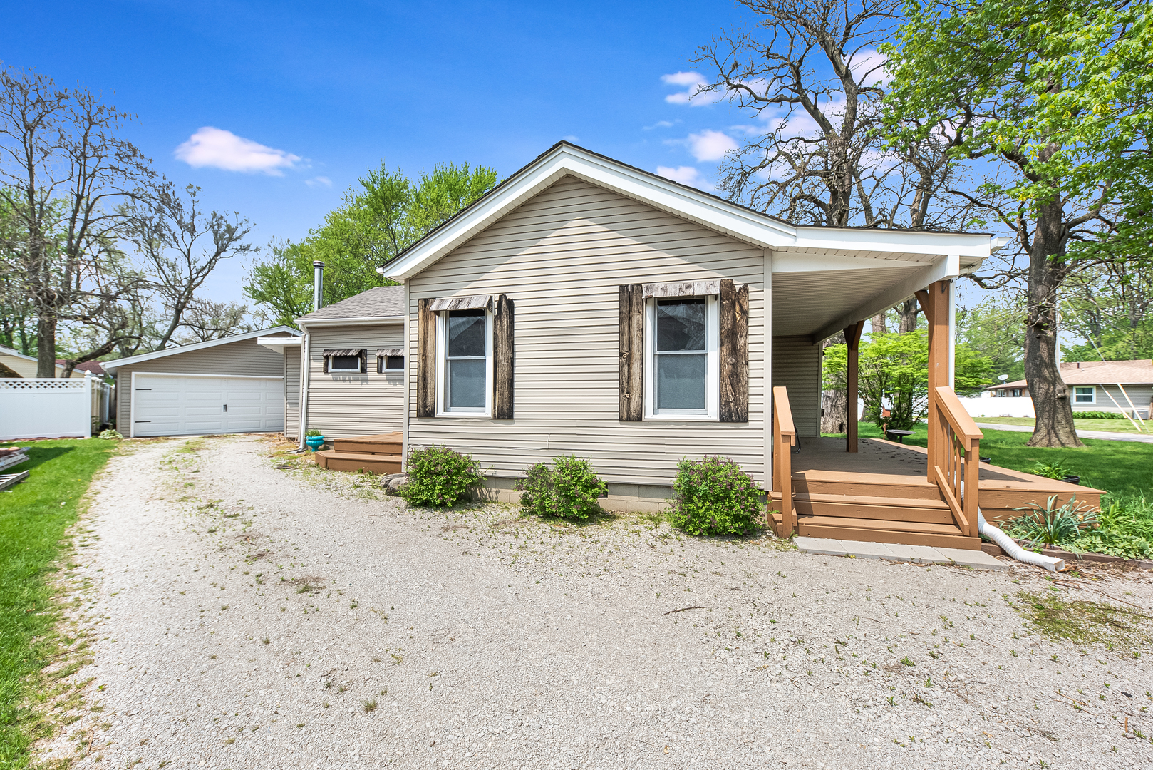 106 Round House Street Braidwood, IL 60408 - Photo 24 of 27 a front view of a house with a yard and garage