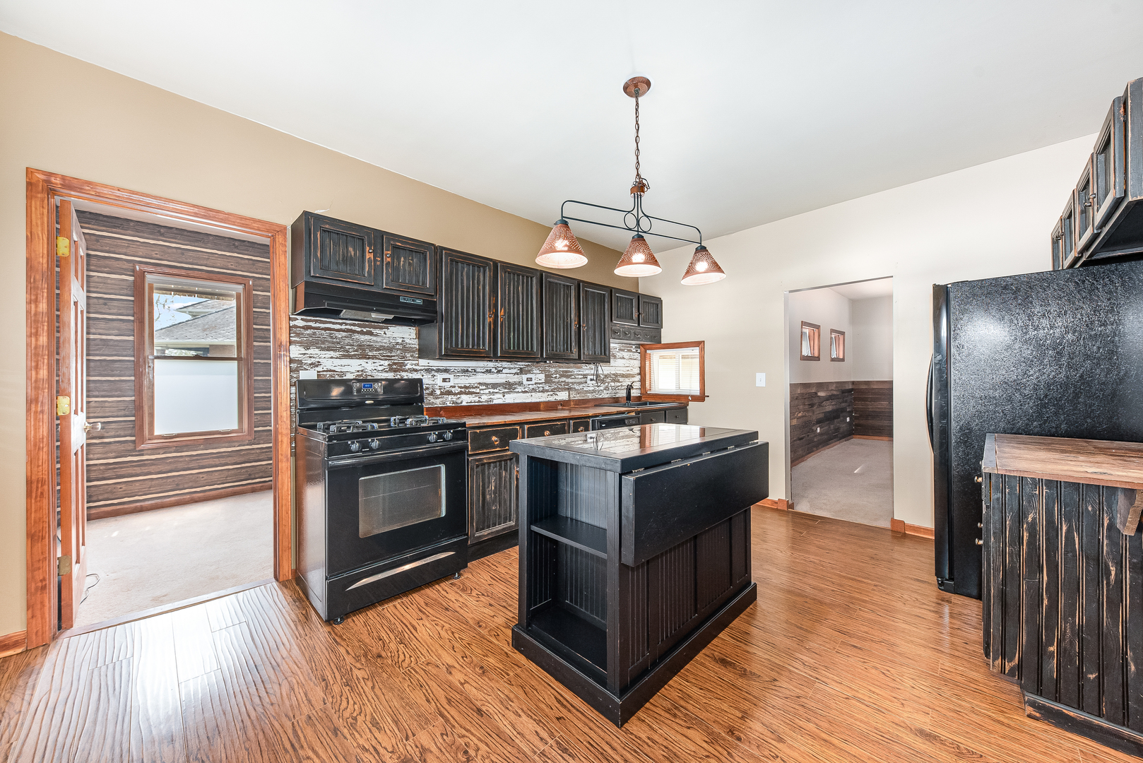 106 Round House Street Braidwood, IL 60408 - Photo 4 of 27 a kitchen with stainless steel appliances granite countertop a stove and a wooden floors