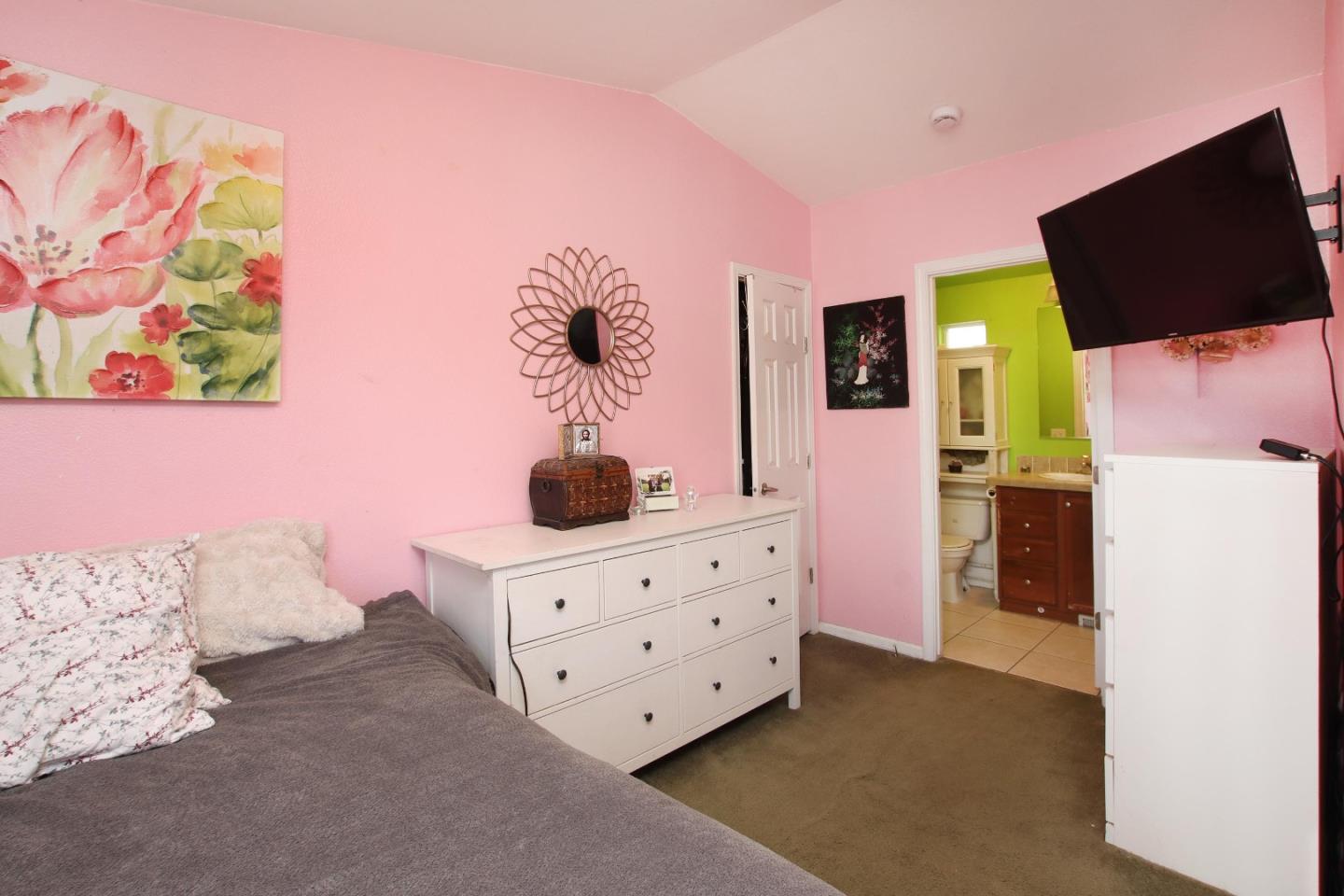 999 Soquel San Jose Road, Unit 81 Soquel, CA 95073 - Photo 13 of 17 a bedroom with a bed and flat screen tv