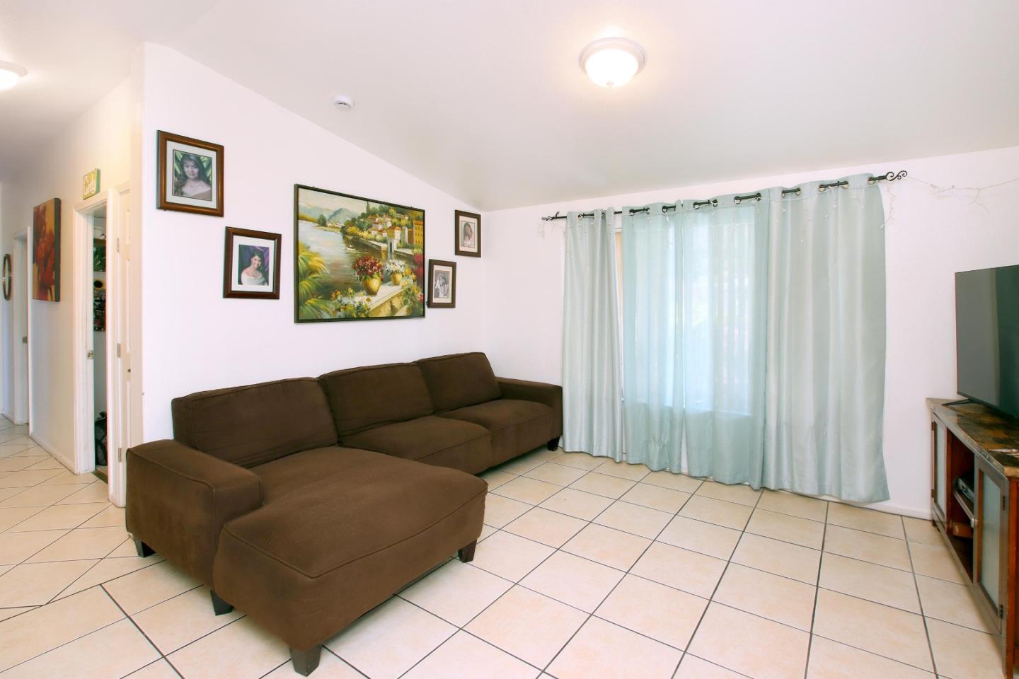 999 Soquel San Jose Road, Unit 81 Soquel, CA 95073 - Photo 4 of 17 a living room with furniture and a flat screen tv