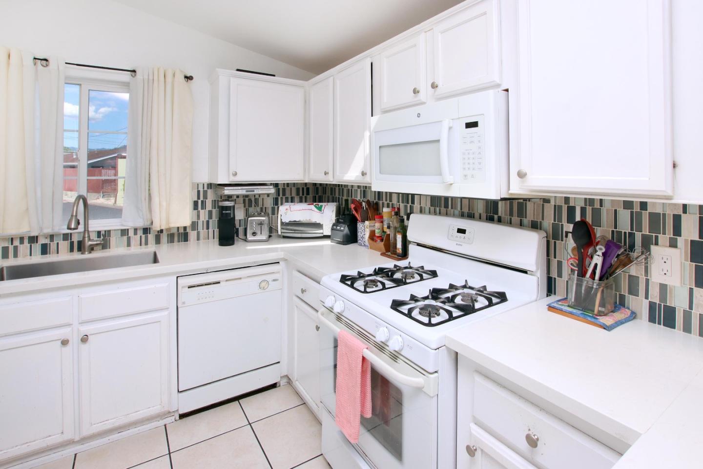 999 Soquel San Jose Road, Unit 81 Soquel, CA 95073 - Photo 8 of 17 a kitchen with white cabinets and appliances