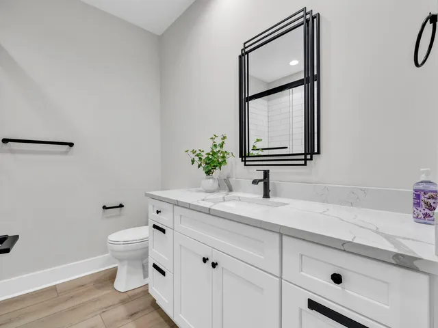 a view of an empty room with a fireplace