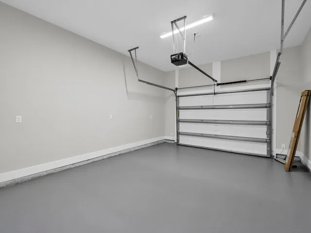 a view of entryway with furniture and wooden floor