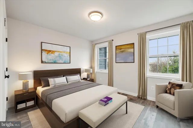 a bedroom with a bed and a couch