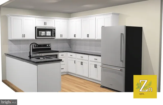 a kitchen with stainless steel appliances a refrigerator stove and microwave