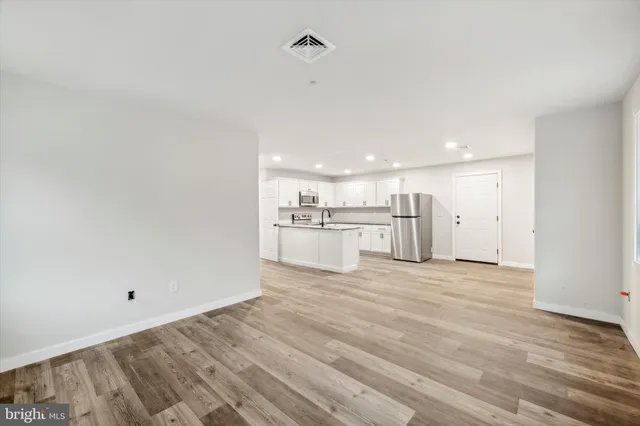 a view of kitchen with wooden floor