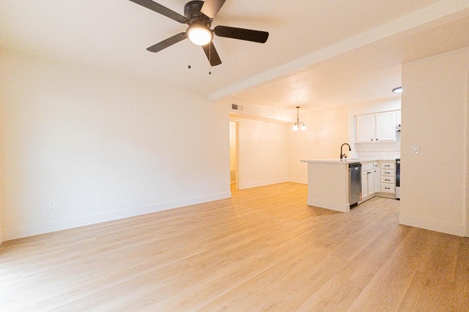 a view of a storage & utility room with wooden floor