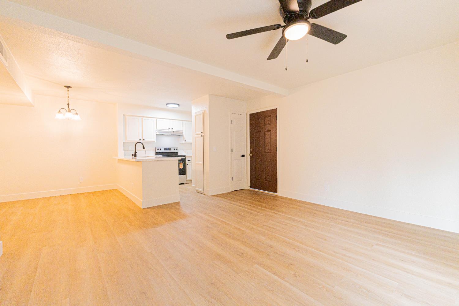 2909 Huntington Boulevard, Unit 107 Fresno, CA 93721 - Photo 2 of 9 a view of a kitchen with a sink and a refrigerator