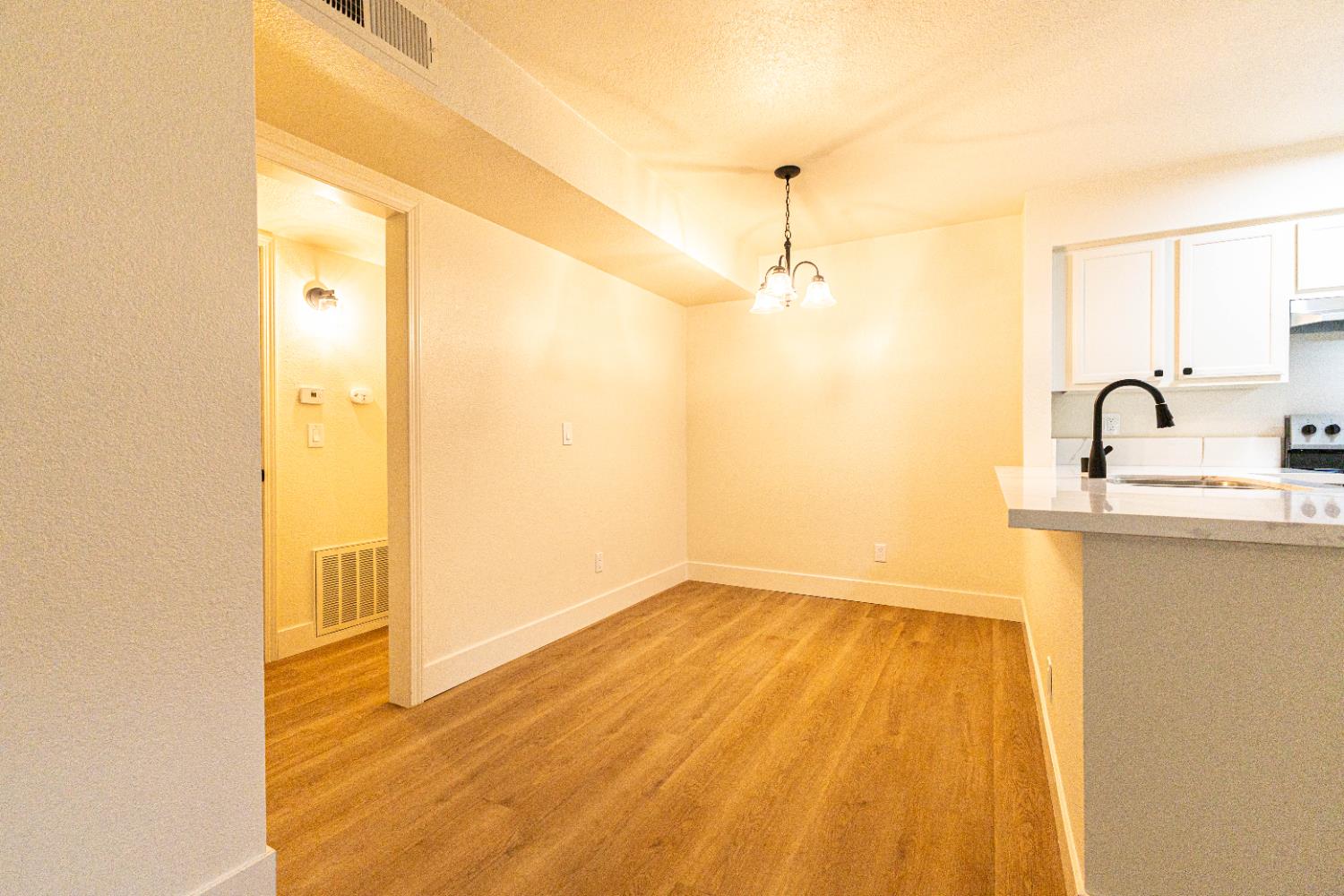 2909 Huntington Boulevard, Unit 107 Fresno, CA 93721 - Photo 3 of 9 a bathroom with a sink shower and a mirror