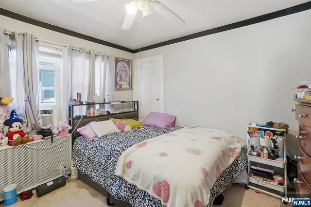 a bed room with a bed and a window