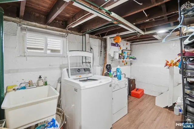 a view of a workspace with furniture and a gate