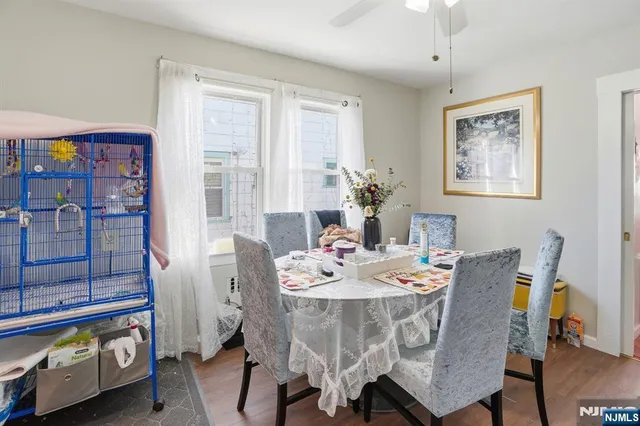 a dining room with furniture and window