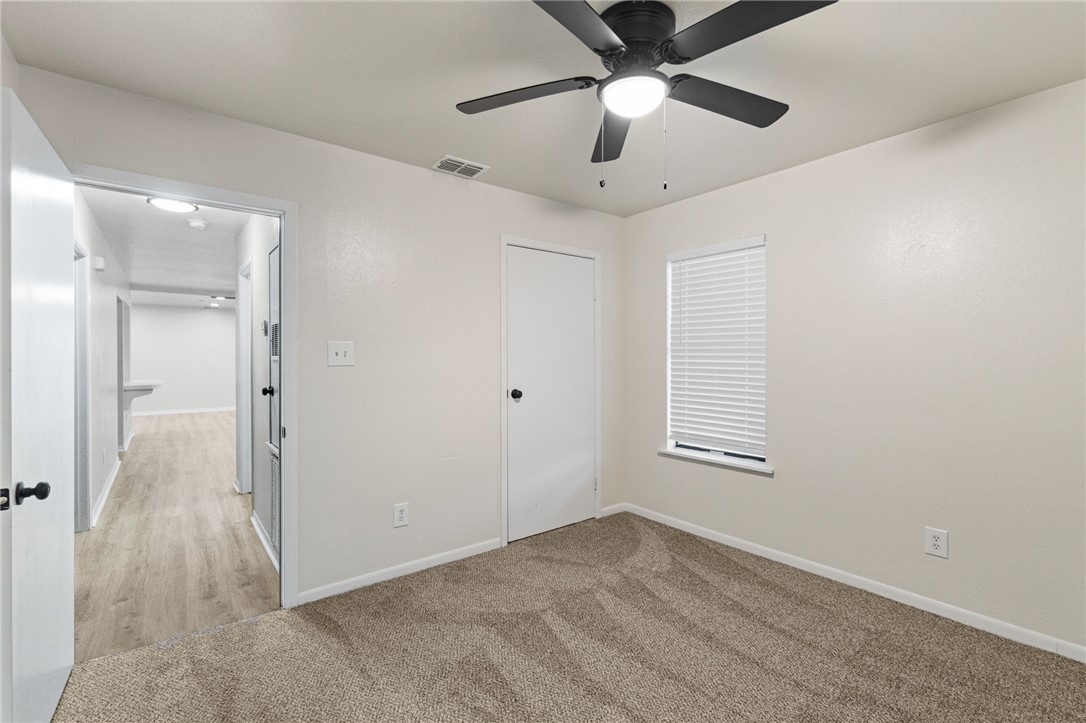 5921 Riley Drive Corpus Christi, TX 78412 - Photo 18 of 20 an empty room with windows and fan