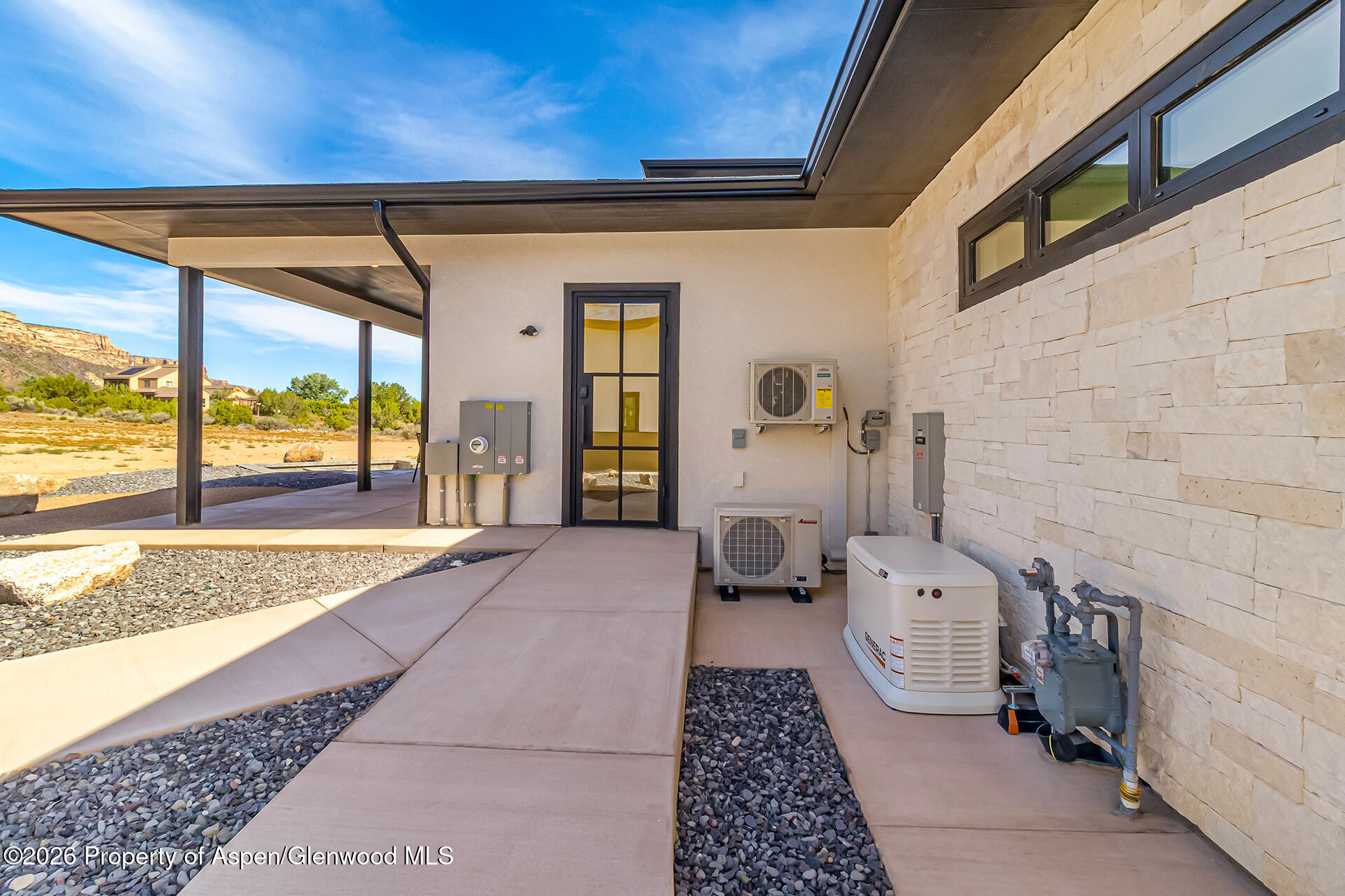 2216 Rimrock Road Grand Junction, CO 81507 - Photo 17 of 84 a view of a porch with wooden floor and furniture