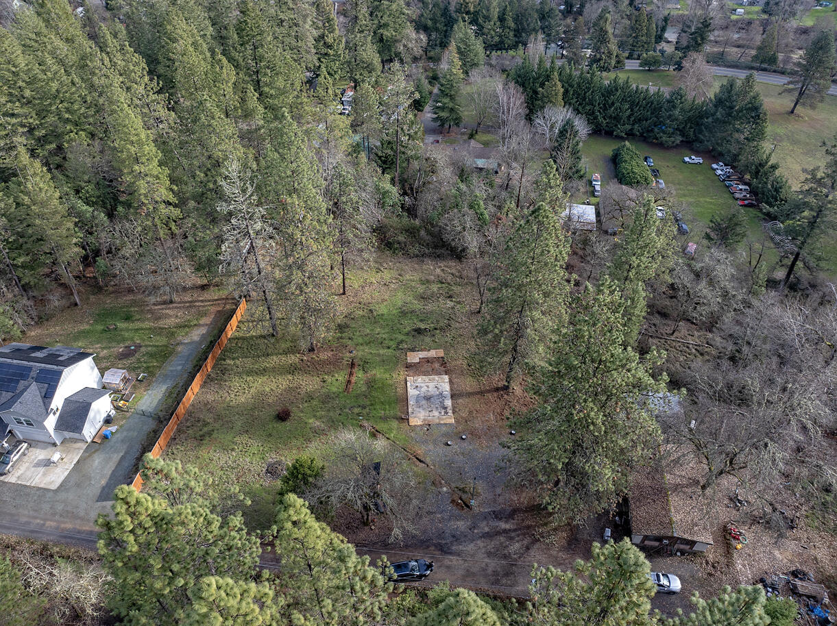 1329 West Evans Creek Road Rogue River, OR 97537 - Photo 1 of 23 an aerial view of a house with a yard