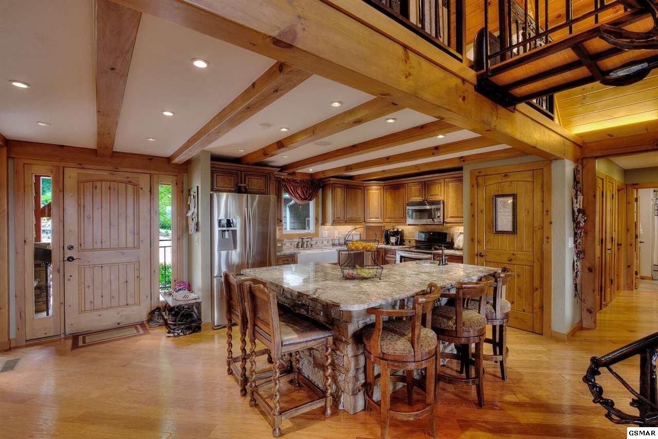 796 Deer Ridge Drive Rutledge, TN 37861 - Photo 11 of 35 a view of a dining room with furniture and a chandelier