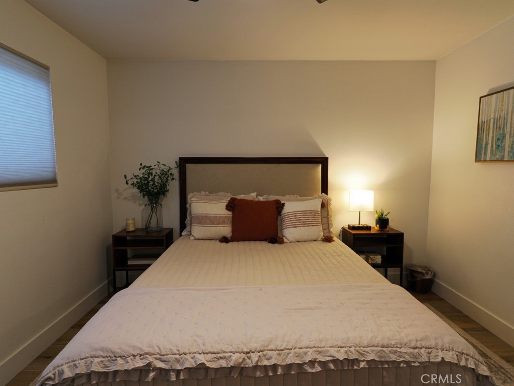28596 North Bay Road Lake Arrowhead, CA 92352 - Photo 59 of 69 a large bed sitting in a bedroom next to a lamp
