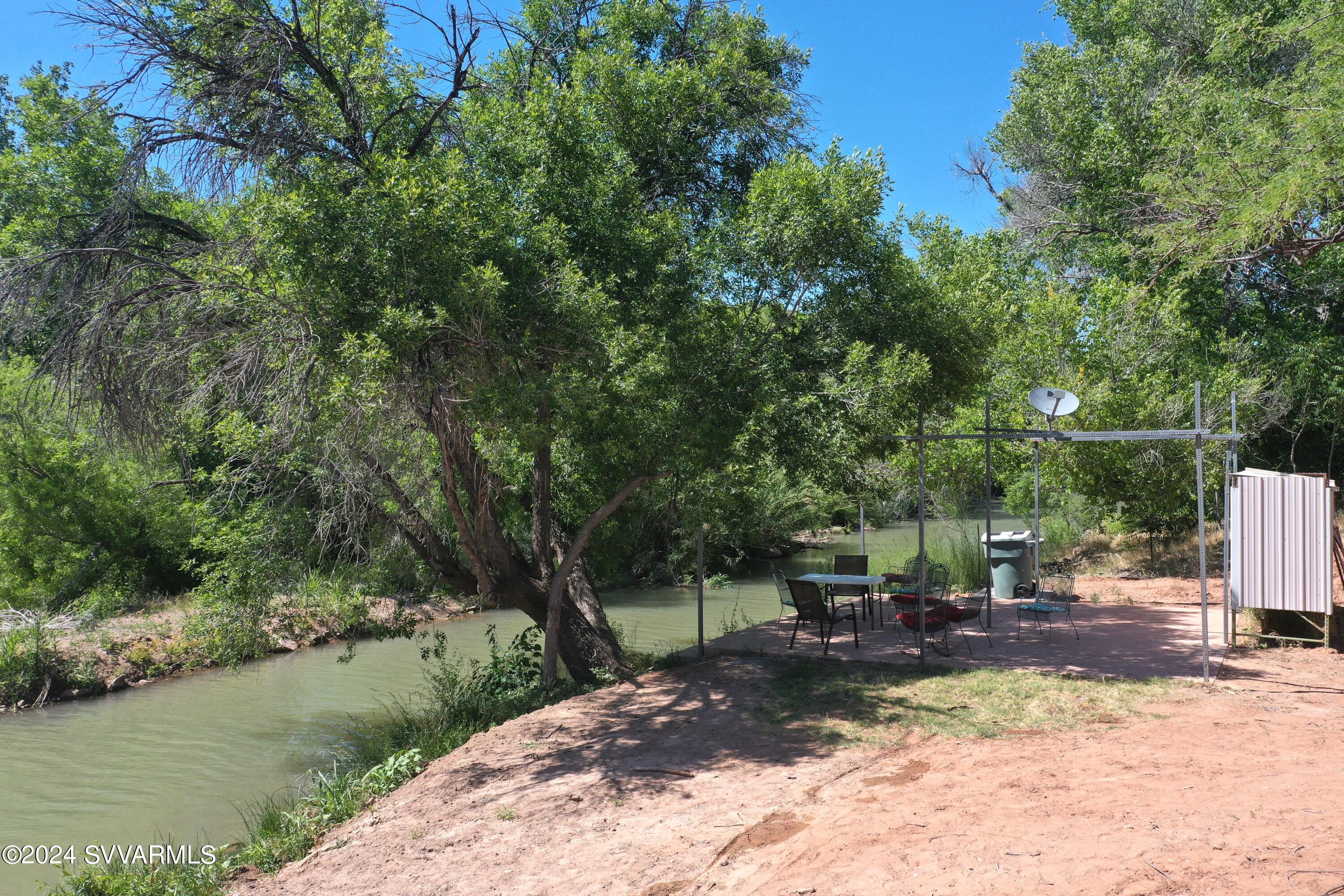 463 East Cocktail Trail Camp Verde, AZ 86322 - Photo 49 of 61 a view of a patio with table and chairs under an umbrella