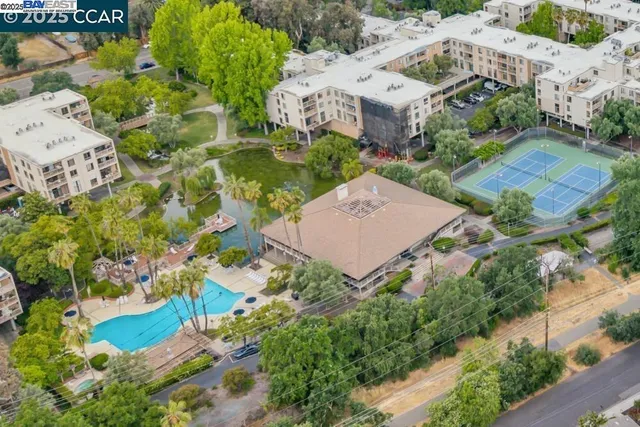 a building outdoor space with patio furniture and potted plants