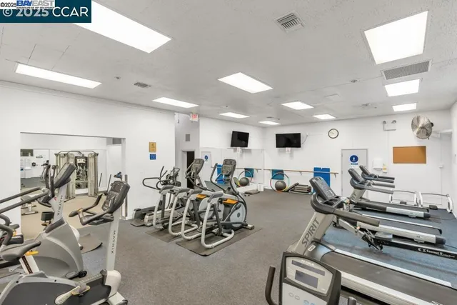 a swimming pool with outdoor seating and plants