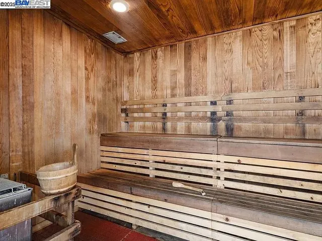 a view of swimming pool with outdoor seating and yard