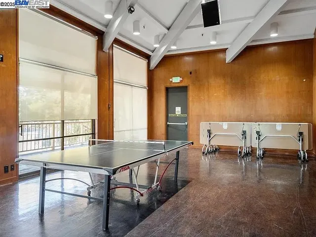 a view of a house with a yard and parking space