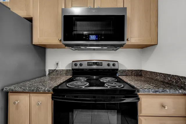 a kitchen with a stove and a microwave