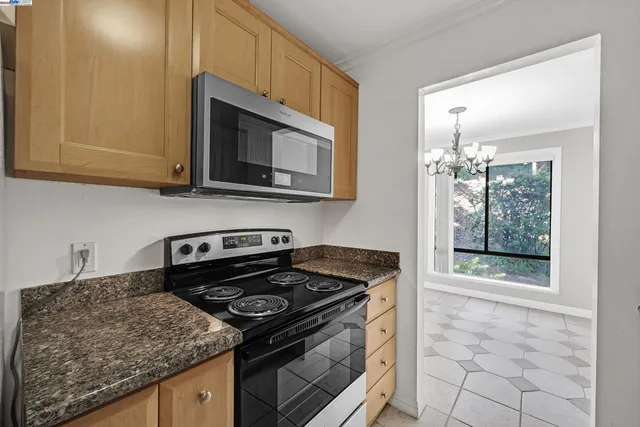 a kitchen with a stove and a microwave