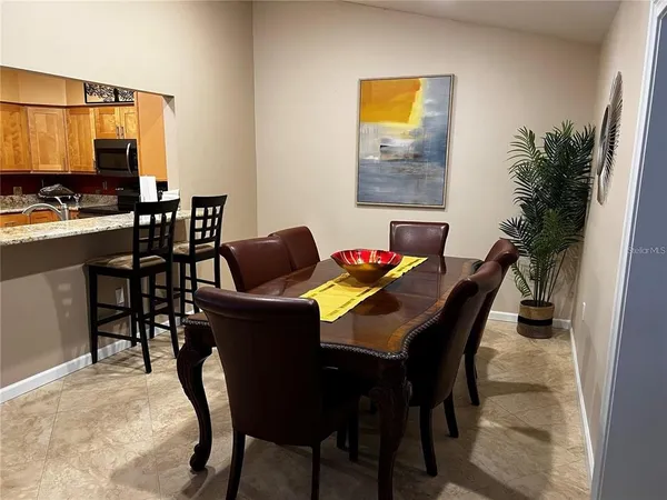 a dining room with furniture and window