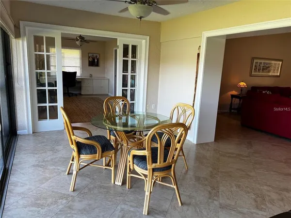 a dining room with furniture and chandelier