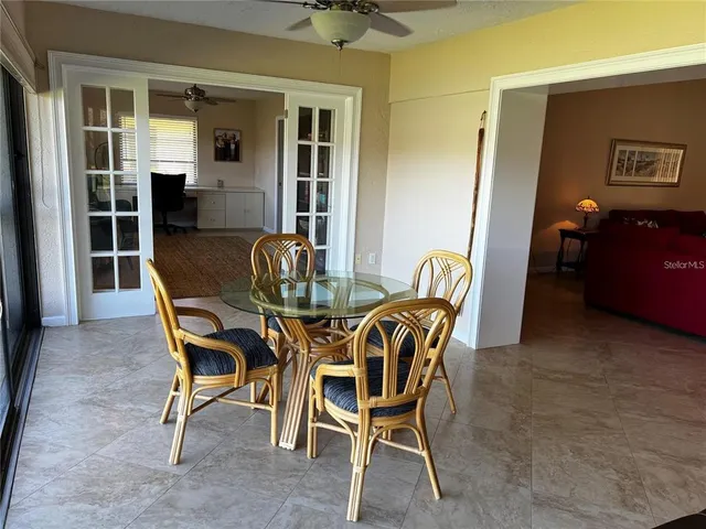 a dining room with furniture and chandelier