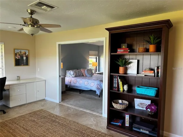 a bedroom with a bed and a tv in it