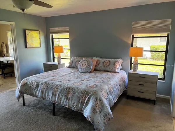 a bedroom with a bed and window