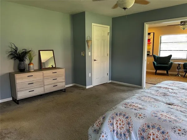 a bedroom with a bed and a couch